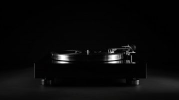 A high-contrast shot of a sleek vinyl record player